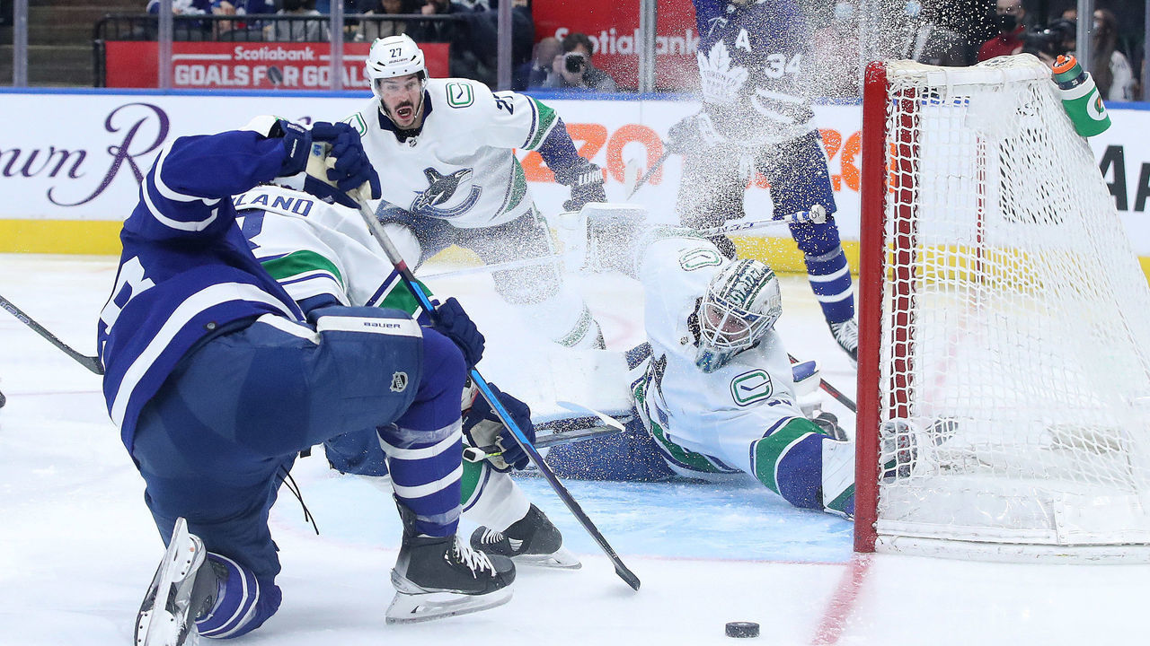 TORONTO, ON- MARCH 5 - Toronto Maple Leafs left wing Michael Bunting (58) fans on a shot as Vancouver Canucks goaltender Thatcher Demko (35) covers the net as the Toronto Maple Leafs fall to the Vancouver Canucks 6-4 at Scotiabank Arena in Toronto. March 5, 2022. (Steve Russell/Toronto Star via Getty Images)