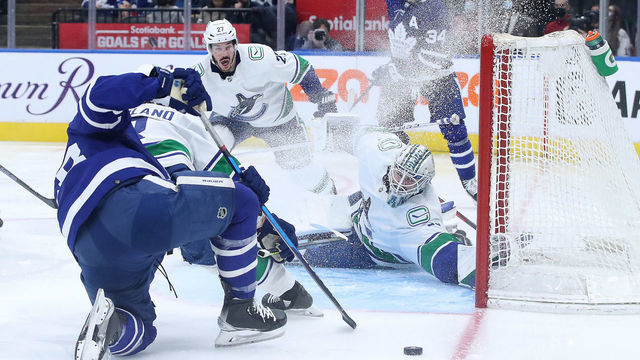 TORONTO, ON- MARCH 5 - Toronto Maple Leafs left wing Michael Bunting (58) fans on a shot as Vancouver Canucks goaltender Thatcher Demko (35) covers the net as the Toronto Maple Leafs fall to the Vancouver Canucks 6-4 at Scotiabank Arena in Toronto. March 5, 2022. (Steve Russell/Toronto Star via Getty Images)