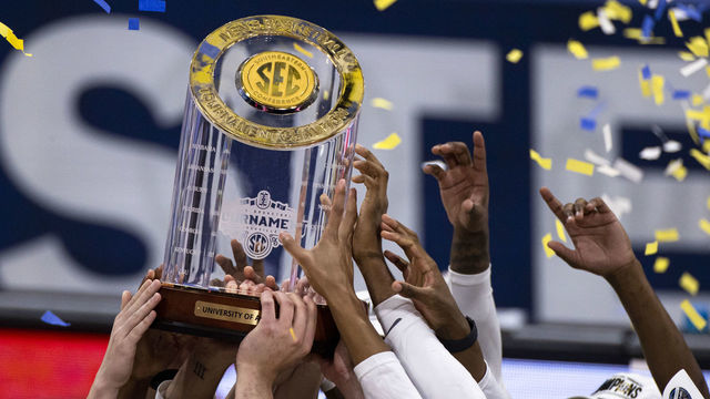 NASHVILLE, TN - MARCH 14: Alabama Crimson Tide hoist the SEC Championship trophy after the championship game against the LSU Tigers in the SEC Men's Basketball Tournament at Bridgestone Arena on March 14, 2021 in Nashville, Tennessee. Alabama defeats LSU 80-79.