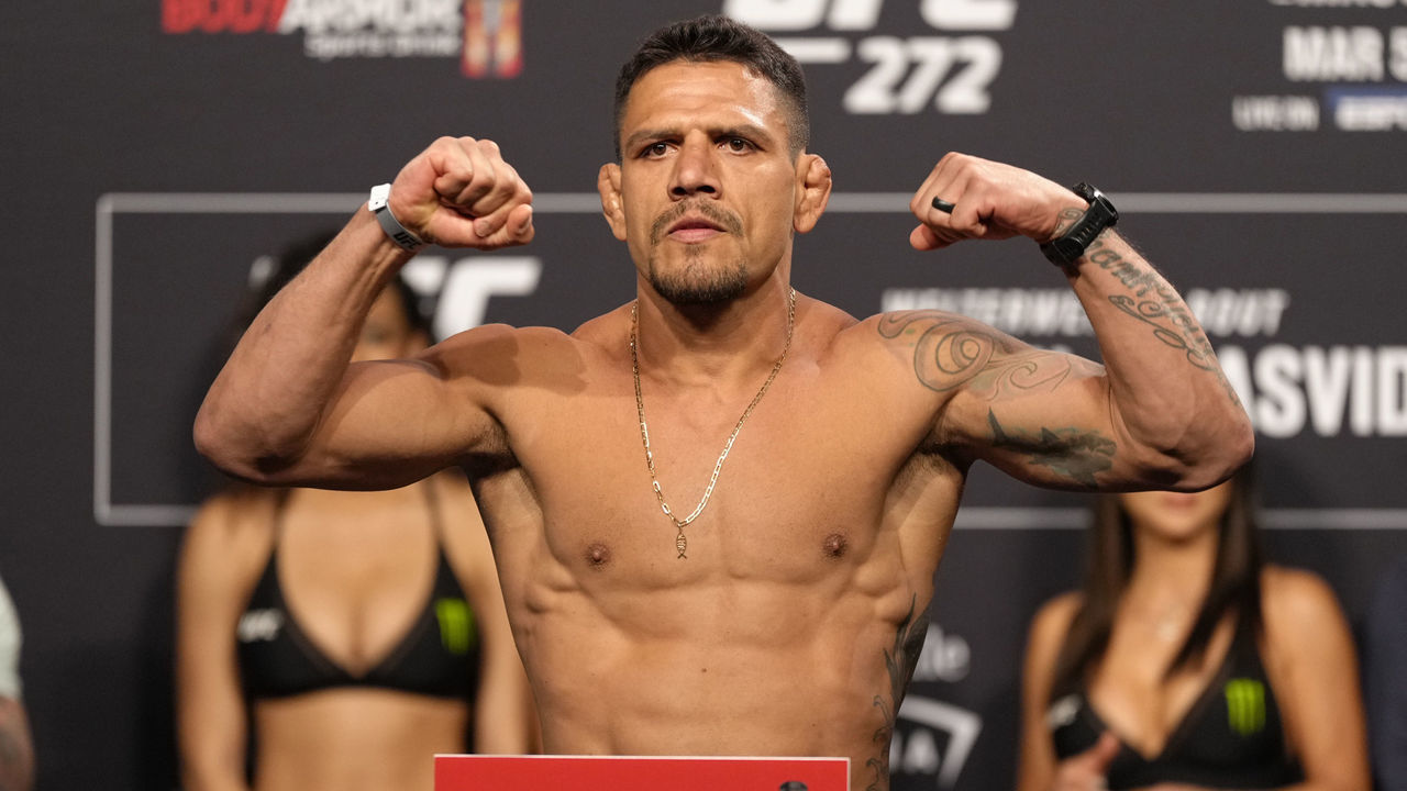 LAS VEGAS, NEVADA - MARCH 04: Rafael Dos Anjos of Brazil poses on the scale during the UFC 272 ceremonial weigh-in at UFC T-Mobile Arena on March 04, 2022 in Las Vegas, Nevada.