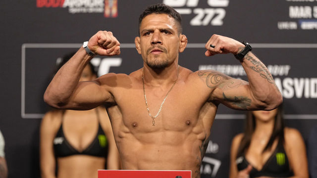 LAS VEGAS, NEVADA - MARCH 04: Rafael Dos Anjos of Brazil poses on the scale during the UFC 272 ceremonial weigh-in at UFC T-Mobile Arena on March 04, 2022 in Las Vegas, Nevada.