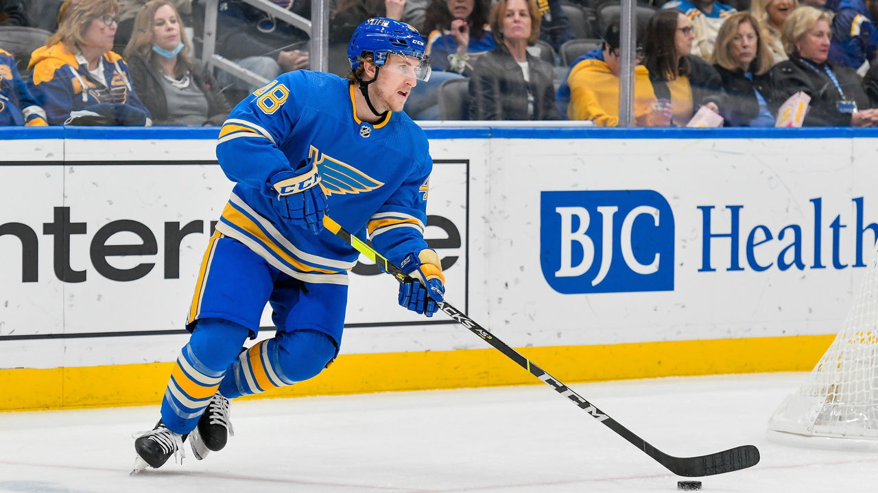 ST. LOUIS, MO - DECEMBER 11: St. Louis Blues defenseman Scott Perunovich (48) skates the puck out from behind his own goal during a game between the Montreal Canadians and the St. Louis Blues on December 11, 2021, at the Enterprise Center in St. Louis MO