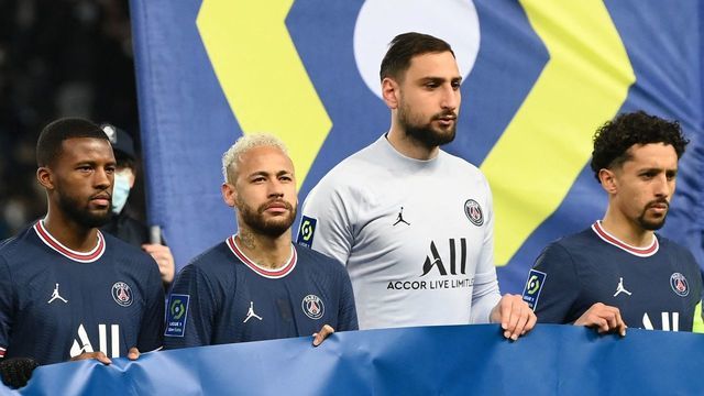 Paris Saint-Germain's Italian goalkeeper Gianluigi Donnarumma and Paris Saint-Germain's Brazilian forward Neymar holds a banner reading " Peace for all" prior the French L1 football match between Paris-Saint Germain (PSG) and Saint-Etienne (ASSE) at The Parc des Princes Stadium in Paris on February 26, 2022.