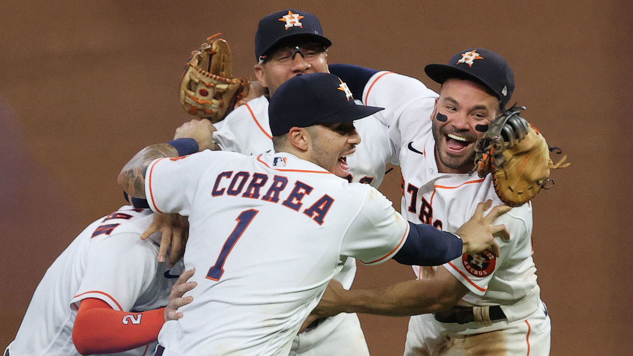 HOUSTON, TEXAS - OCTOBER 22: Yuli Gurriel #10, Alex Bregman #2, Jose Altuve #27 and Carlos Correa #1 of the Houston Astros celebrate after the final out as they defeat the Boston Red Sox 5-0 in Game Six of the American League Championship Series to advance to the World Series at Minute Maid Park on October 22, 2021 in Houston, Texas.