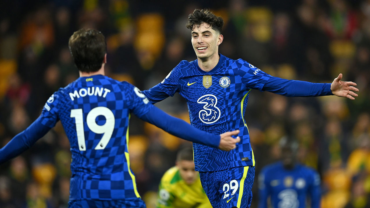 NORWICH, ENGLAND - MARCH 10: Kai Havertz celebrates with Mason Mount of Chelsea after scoring their team's third goal during the Premier League match between Norwich City and Chelsea at Carrow Road on March 10, 2022 in Norwich, England.