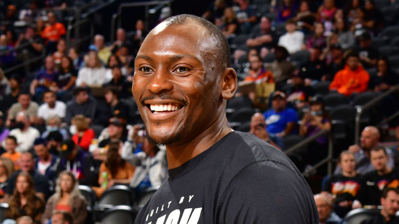 PHOENIX, AZ - FEBRUARY 12: Bismack Biyombo #18 of the Phoenix Suns looks on and smiles before the game against the Orlando Magic on February 12, 2022 at Footprint Center in Phoenix, Arizona. Mandatory Copyright Notice: Copyright 2022 NBAE