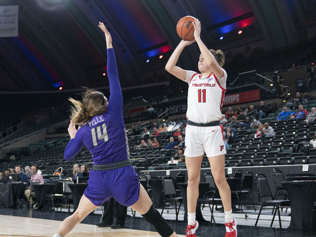 ATLANTIC CITY, NJ - MARCH 11: Fairfield Stags Forward Lou Lopez-Senechal (11) shoots a three point jump shot over Niagara Purple Eagles Guard Maddy Yelle (14) defending during the first half of the MAAC Womens Conference Basketball Tournament quarterfinal game between the Niagara Purple Eagles and the Fairfield Stags on March 11, 2022 at the Boardwalk Hall in Atlantic City, NJ.