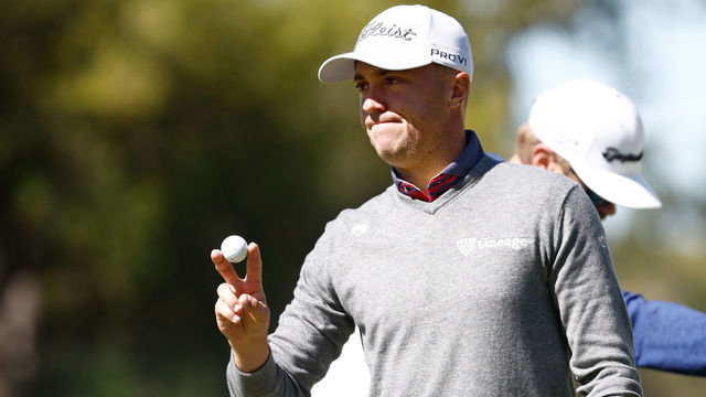 PONTE VEDRA BEACH, FLORIDA - MARCH 12: Justin Thomas of the United States waves after chipping in on the 14th hole during the second round of THE PLAYERS Championship on the Stadium Course at TPC Sawgrass on March 12, 2022 in Ponte Vedra Beach, Florida.