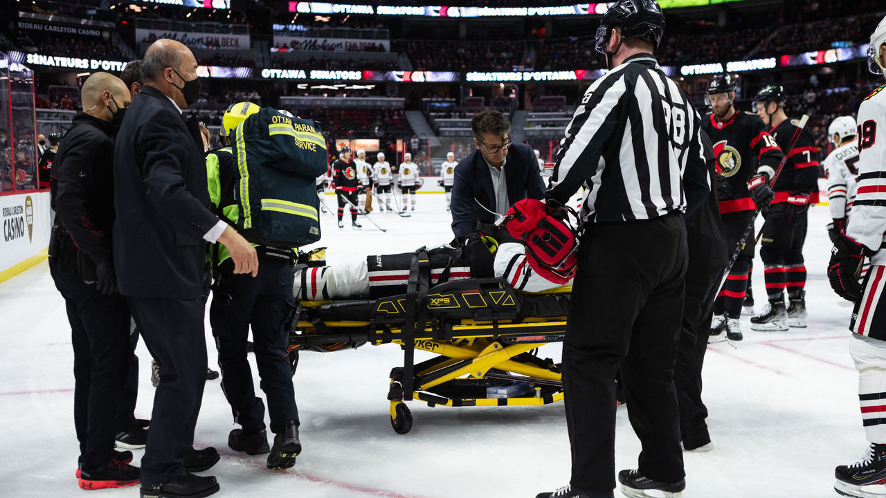 OTTAWA, ON - MARCH 12: Connor Murphy #5 of the Chicago Blackhawks helped off the ice on a stretcher after a big hit from Parker Kelly #45 of the Ottawa Senators [NOT PICTURED] during the first period at the Canadian Tire Centre on March 12, 2022 in Ottawa, Ontario, Canada.