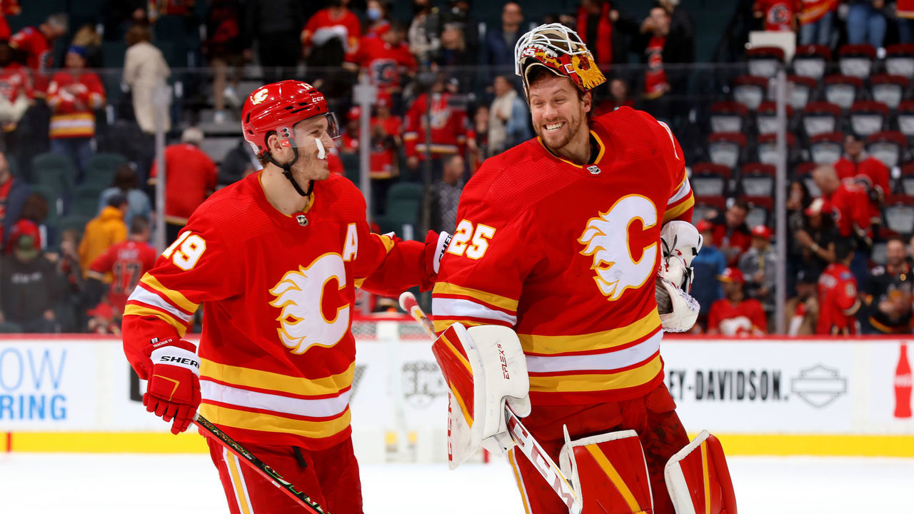 CALGARY, ALBERTA - MARCH 12: Jacob Markstrom #25 and teammates of the Calgary Flames celebrate a win over the Detroit Red Wings at Scotiabank Saddledome on March 12, 2022 in Calgary, Alberta.