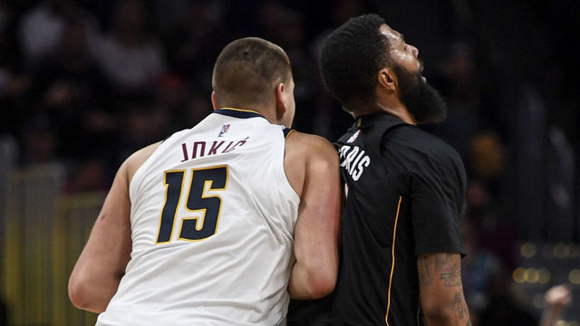 DENVER, CO - NOVEMBER 8: Nikola Jokic (15) of the Denver Nuggets hits Markieff Morris (8) of the Miami Heat with a retaliatory blow after Morris bumped Jokic near mid court during the fourth quarter of Denver"u2019s 113-96 win on Monday, November 8, 2021. The altercation resulted in an ejection for Jokic and a flagrant and two for Morris.