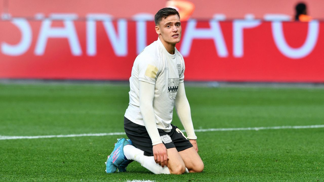 Leverkusen's German forward Florian Wirtz reacts during the German first division Bundesliga football match Bayer Leverkusen v FC Cologne in Leverkusen, western Germany, on March 13, 2022. - DFL REGULATIONS PROHIBIT ANY USE OF PHOTOGRAPHS AS IMAGE SEQUENCES AND/OR QUASI-VIDEO