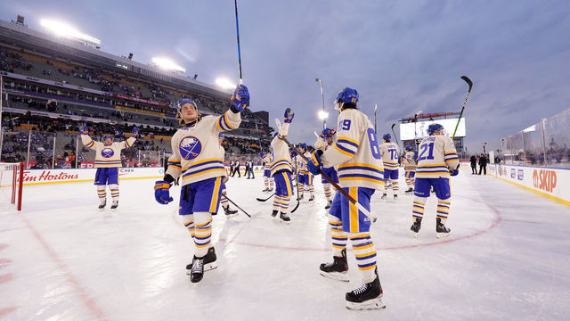 HAMILTON, ONTARIO - MARCH 13: John Hayden #15 of the Buffalo Sabres and teammates salute the stadium fans after the 2022 Tim Hortons NHL Heritage Classic between the Toronto Maple Leafs and the Buffalo Sabres at Tim Hortons Field on March 13, 2022 in Hamilton, Ontario. The Sabres defeated the Leafs 5-2.