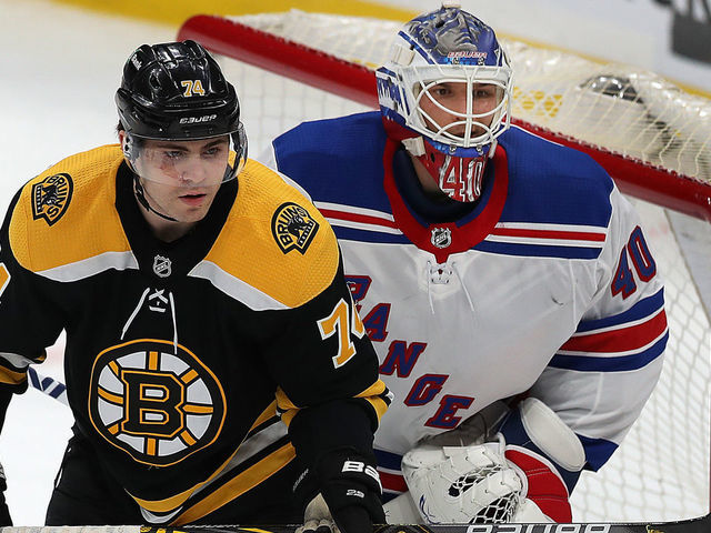 Boston - March 11: Boston Bruins vs NY Rangers on March 11, 2021. Boston Bruins left wing Jake DeBrusk (74) stands in front of Rangers goalie Alexandar Georgiev as he holds his new stick.