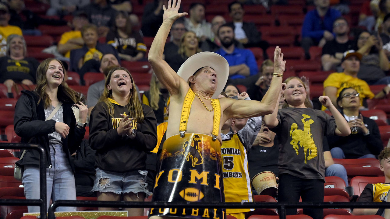 LAS VEGAS, NEVADA - MARCH 11: Wyoming Cowboys fan Ken "Cowboy Ken Barrel Man" Koretos of Wyoming cheers during a semifinal game of the Mountain West Conference basketball tournament against the Boise State Broncos at the Thomas & Mack Center on March 11, 2022 in Las Vegas, Nevada. Boise State won 68-61.
