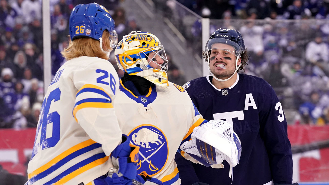 HAMILTON, ONTARIO - MARCH 13: Goaltender Craig Anderson #41 of the Buffalo Sabres gets between Rasmus Dahlin #26 of the Buffalo Sabres and Auston Matthews #34 of the Toronto Maple Leafs after the play was whistled dead during the third period of the 2022 Tim Hortons NHL Heritage Classic between the Toronto Maple Leafs and the Buffalo Sabres at Tim Hortons Field on March 13, 2022 in Hamilton, Ontario.