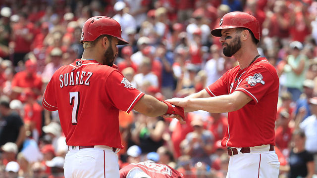 CINCINNATI, OHIO - JULY 31: Eugenio Suarez #7 of the Cincinnati Reds celebrates with Jesse Winker #33 after hitting a home run in the third inning against the Pittsburgh Pirates at Great American Ball Park on July 31, 2019 in Cincinnati, Ohio.