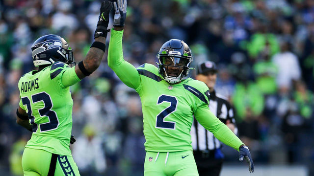 SEATTLE, WA - OCTOBER 07: Safety Jamal Adams #33 of the Seattle Seahawks and cornerback D.J. Reed #2 celebrate a stop against the Los Angeles Rams in the first half at Lumen Field on October 7, 2021 in Seattle, Washington.