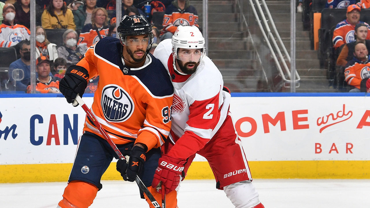 EDMONTON, AB - MARCH 15: Evander Kane #91 of the Edmonton Oilers battles for position against Nick Leddy #2 of the Detroit Red Wings on March 15, 2022 at Rogers Place in Edmonton, Alberta, Canada.