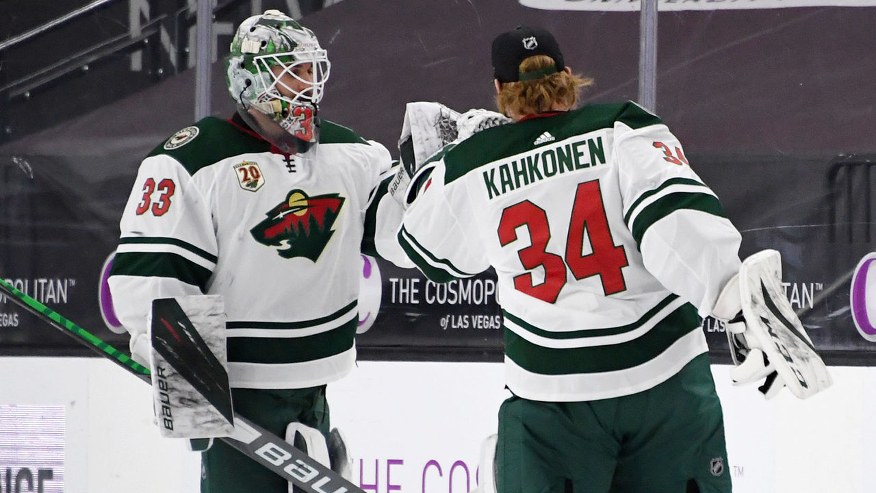 LAS VEGAS, NEVADA - APRIL 01: Cam Talbot #33 and Kaapo Kahkonen #34 of the Minnesota Wild celebrate on the ice after the team's 3-2 shootout victory over the Vegas Golden Knights at T-Mobile Arena on April 1, 2021 in Las Vegas, Nevada.
