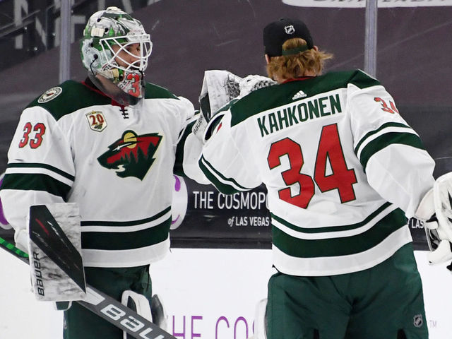 LAS VEGAS, NEVADA - APRIL 01: Cam Talbot #33 and Kaapo Kahkonen #34 of the Minnesota Wild celebrate on the ice after the team's 3-2 shootout victory over the Vegas Golden Knights at T-Mobile Arena on April 1, 2021 in Las Vegas, Nevada.