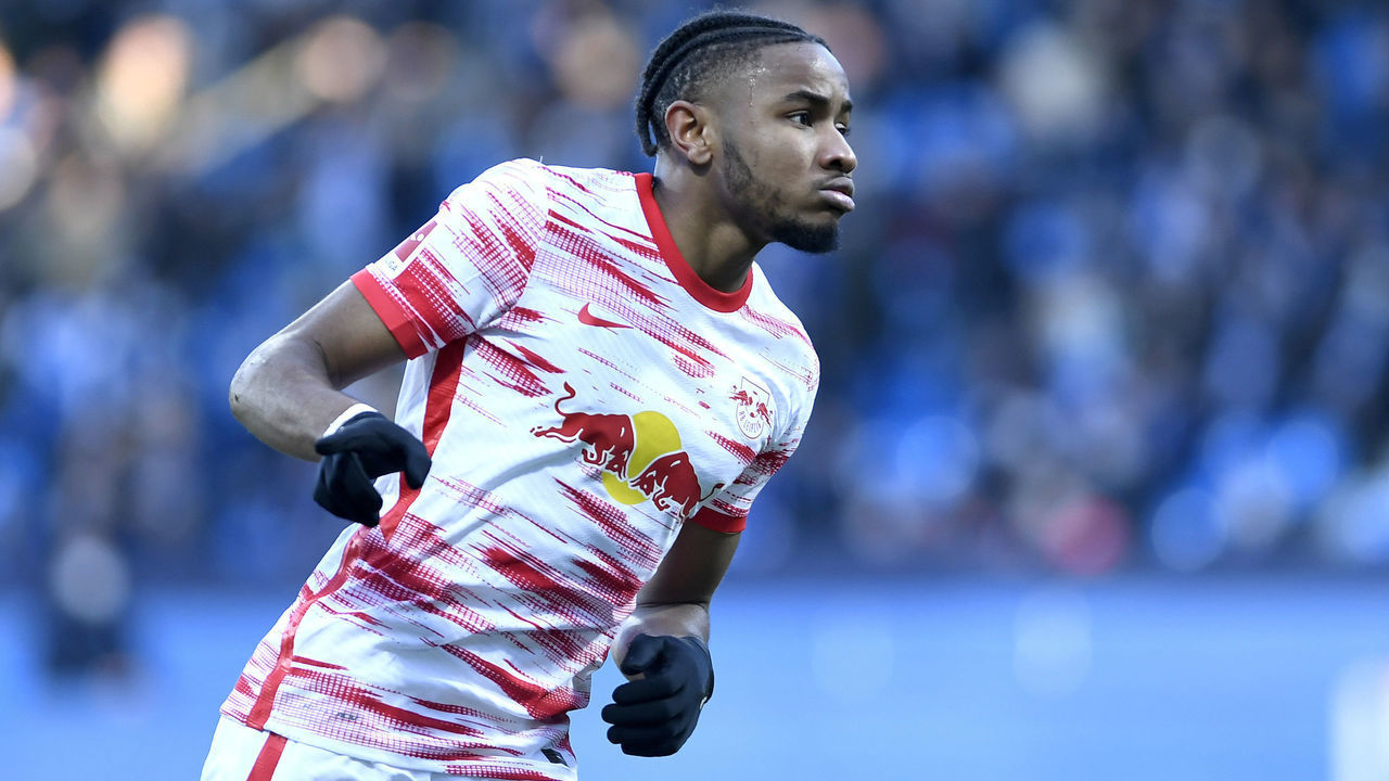 BOCHUM, GERMANY - FEBRUARY 27: Christopher Nkunku of RB Leipzig celebrates after scoring his teams first goal during the Bundesliga match between VfL Bochum and RB Leipzig at Vonovia Ruhrstadion on February 27, 2022 in Bochum, Germany.