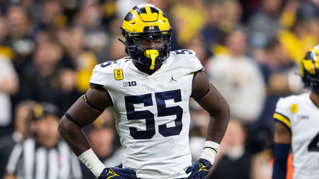 INDIANAPOLIS, IN - DECEMBER 04: Michigan Wolverines linebacker David Ojabo (55) stands by the defensive huddle during the Big 10 Championship game between the Michigan Wolverines and Iowa Hawkeyes on December 4, 2021, at Lucas Oil Stadium in Indianapolis, IN.