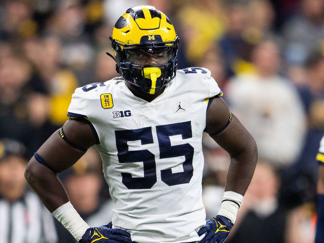 INDIANAPOLIS, IN - DECEMBER 04: Michigan Wolverines linebacker David Ojabo (55) stands by the defensive huddle during the Big 10 Championship game between the Michigan Wolverines and Iowa Hawkeyes on December 4, 2021, at Lucas Oil Stadium in Indianapolis, IN.
