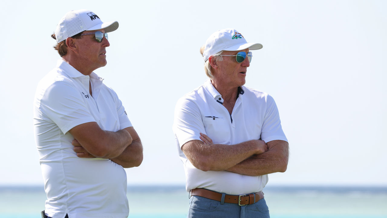 AL MUROOJ, SAUDI ARABIA - FEBRUARY 02: Phil Mickelson of USA and Greg Norman, CEO of Liv Golf Investments interact during a practice round prior to the PIF Saudi International at Royal Greens Golf & Country Club on February 02, 2022 in Al Murooj, Saudi Arabia.