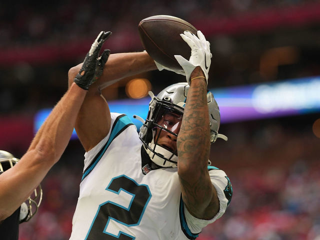 ATLANTA, GEORGIA - OCTOBER 31: DJ Moore #2 of the Carolina Panthers makes a catch while being guarded by Erik Harris #23 of the Atlanta Falcons in the first quarter at Mercedes-Benz Stadium on October 31, 2021 in Atlanta, Georgia.
