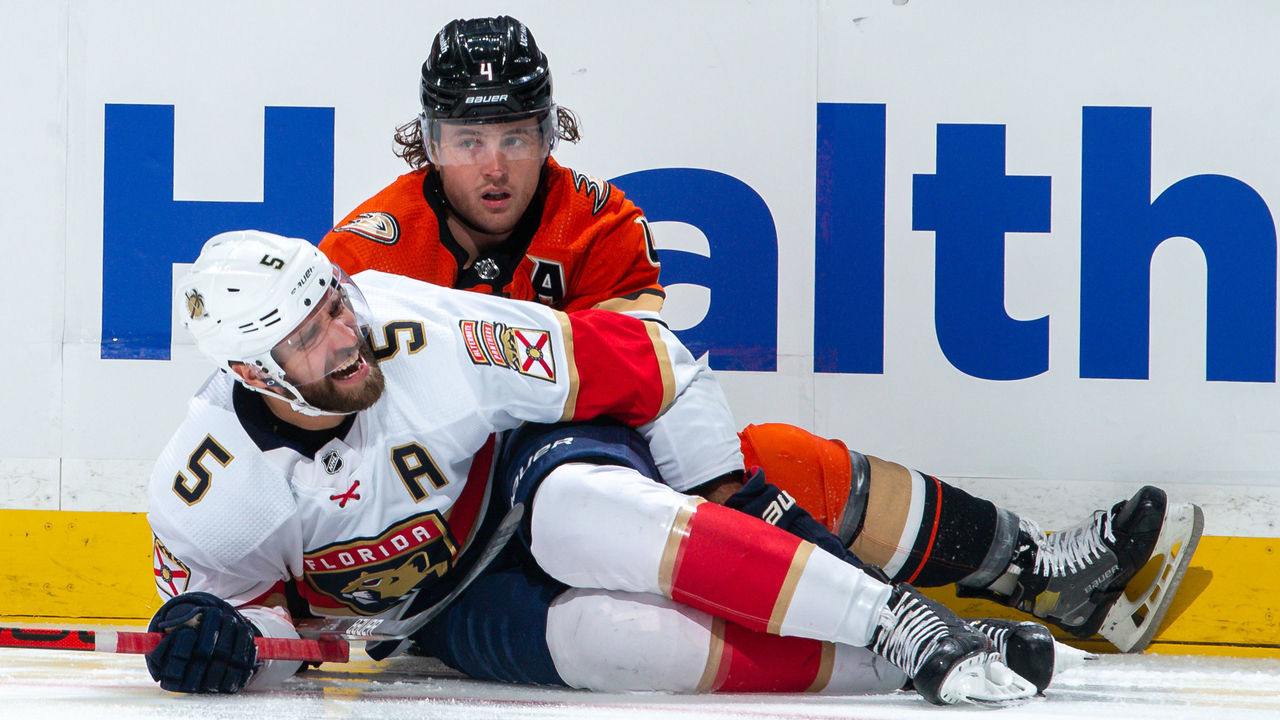ANAHEIM, CA - MARCH 18: Aaron Ekblad #5 of the Florida Panthers reacts after suffering an injury in a collision with Cam Fowler #4 of the Anaheim Ducks during the first period of the game at Honda Center on March 18, 2022 in Anaheim, California.