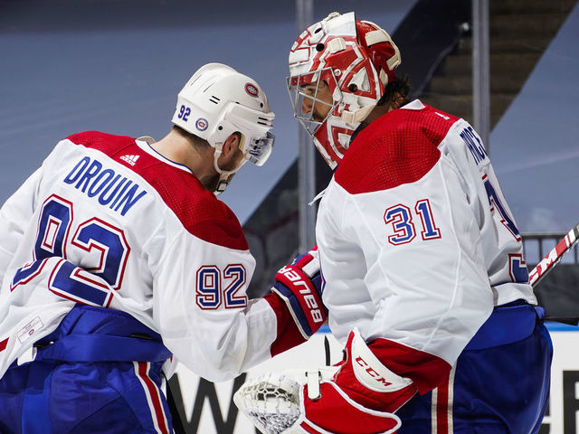 TORONTO, ONTARIO - AUGUST 14: Carey Price #31 of the Montreal Canadiens celebrates with teammate Jonathan Drouin #92 after defeating the Philadelphia Flyers in Game Two of the Eastern Conference First Round of the 2020 NHL Stanley Cup Playoff at Scotiabank Arena on August 14, 2020 in Toronto, Ontario.