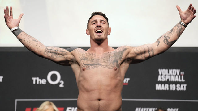 LONDON, ENGLAND - MARCH 18: Tom Aspinall of England poses on the scale during the UFC Fight Night ceremonial weigh-in at O2 Arena on March 18, 2022 in London, England.