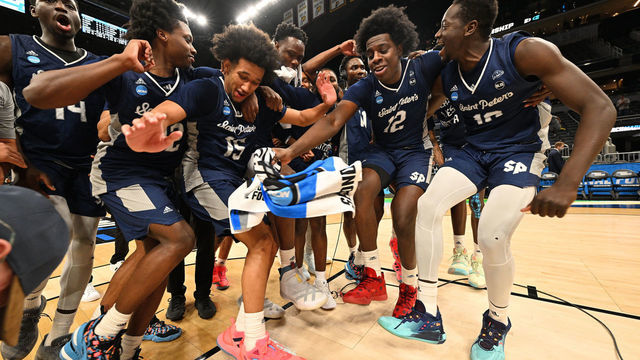 INDIANAPOLIS, IN - MARCH 19: St. Peter's Peacocks players celebrate after they defeated the Murray State Racers in the second round of the 2022 NCAA Men's Basketball Tournament held at Gainbridge Fieldhouse on March 19, 2022 in Indianapolis, Indiana. Murray State won 70-60.
