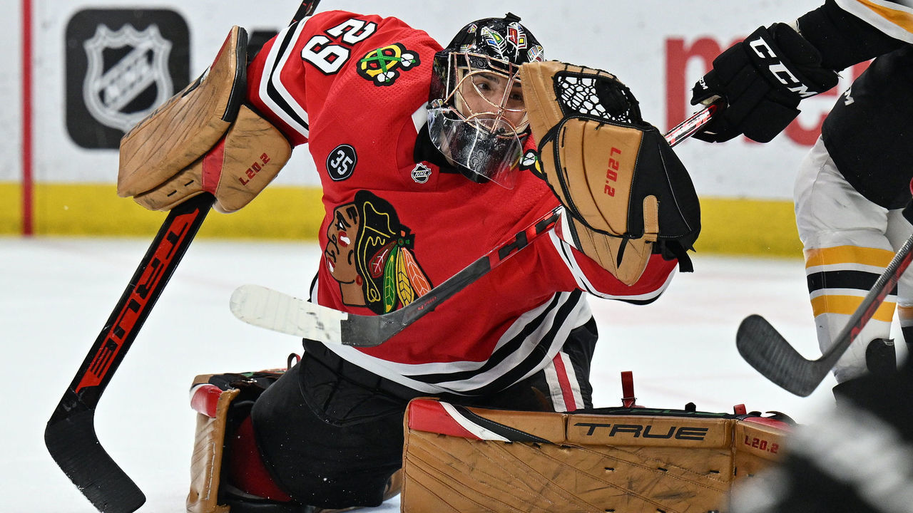 CHICAGO, ILLINOIS - MARCH 15: Goaltender Marc-Andre Fleury #29 of the Chicago Blackhawks snags the puck in his glove for a save in the third period against the Boston Bruins on March 15, 2022 at the United Center in Chicago, Illinois. Boston defeated Chicago 2-1 in overtime.