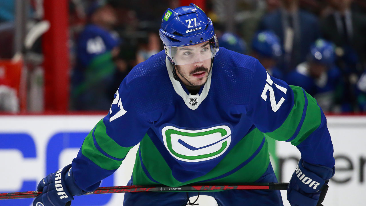VANCOUVER, BC - MARCH 9: Travis Hamonic #27 of the Vancouver Canucks waits for a face-off during their NHL game against the Montreal Canadiens at Rogers Arena March 9, 2022 in Vancouver, British Columbia, Canada. Vancouver won 5-3. "n