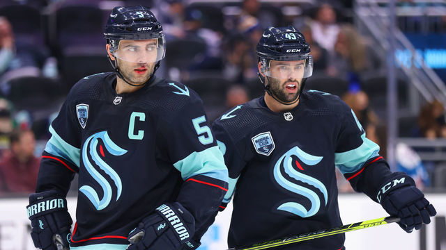 SEATTLE, WASHINGTON - JANUARY 01: Mark Giordano #5 and Colin Blackwell #43 of the Seattle Kraken react during the third period against the Vancouver Canucks at Climate Pledge Arena on January 01, 2022 in Seattle, Washington.