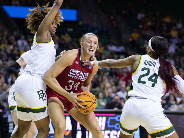 WACO, TX - MARCH 20: Hannah Sjerven #34 of the South Dakota Coyotes defends against Sarah Andrews #24 of the Baylor Bears in the second round of the 2022 NCAA Women's Basketball Tournament held at the Ferrell Center on March 20, 2022 in Waco, Texas.