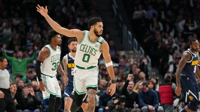 DENVER, CO - MARCH 20: Jayson Tatum #0 of the Boston Celtics celebrates a three pointer against the Denver Nuggets at Ball Arena on March 20, 2022 in Denver, Colorado. NOTE TO USER: User expressly acknowledges and agrees that, by downloading and or using this photograph, User is consenting to the terms and conditions of the Getty Images License Agreement.