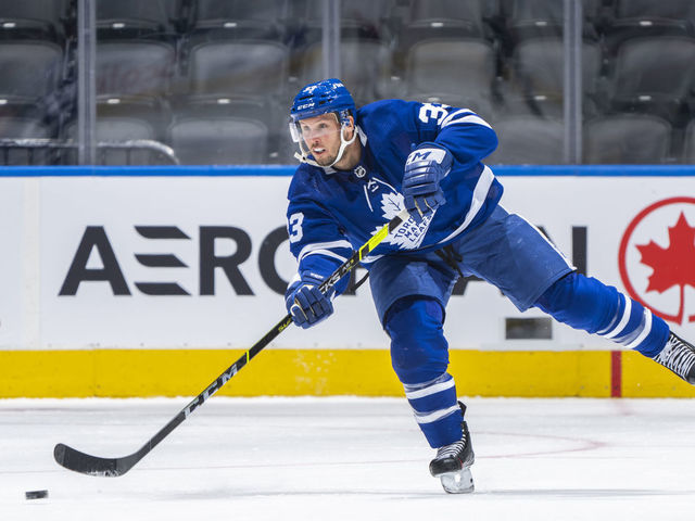TORONTO, ON - JANUARY 1: Alex Biega #33 of the Toronto Maple Leafs skates against the Ottawa Senators during the first period at the Scotiabank Arena on January 1, 2022 in Toronto, Ontario, Canada.