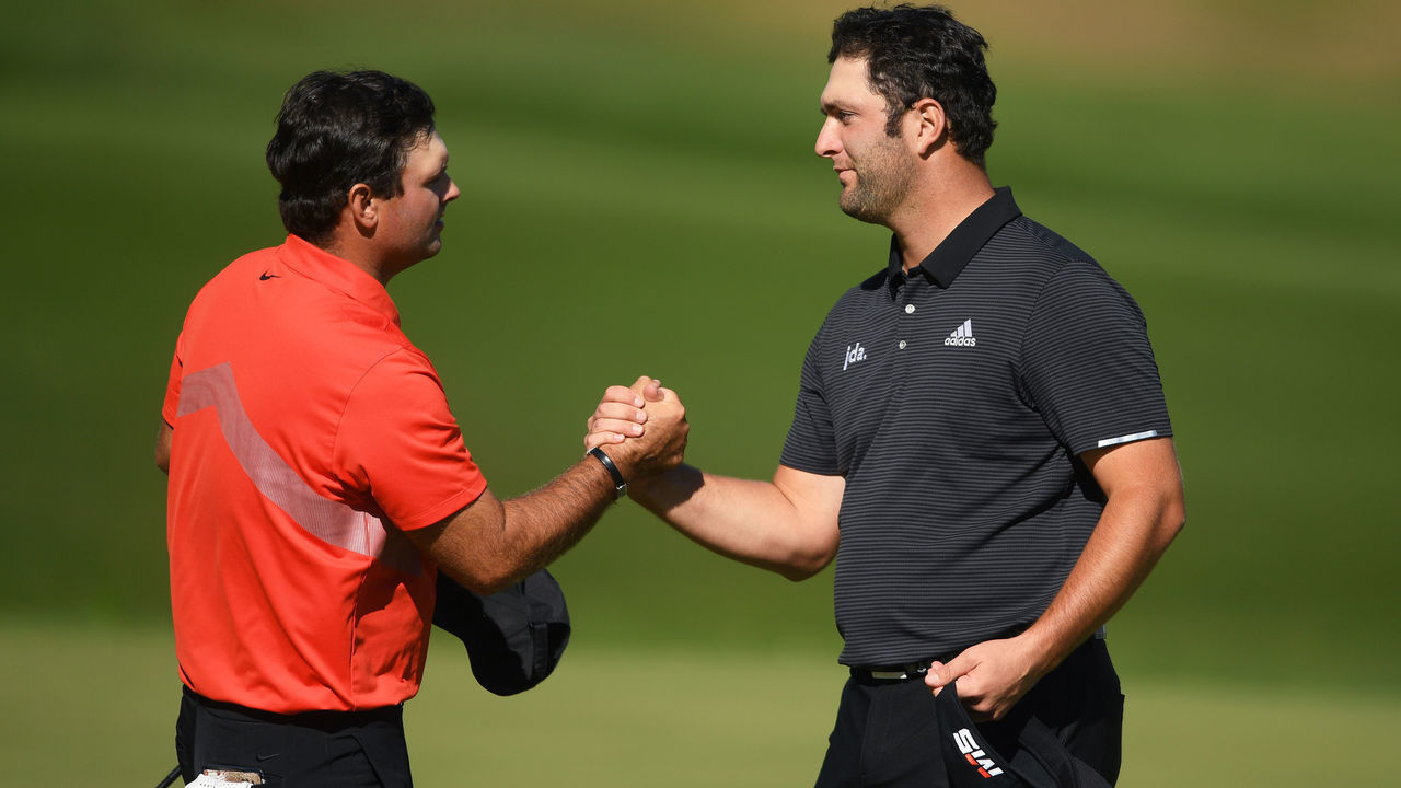 VIRGINIA WATER, ENGLAND - SEPTEMBER 20: Jon Rahm of Spain (R) and Patrick Reed of the USA shake hands after finishing on the eighteenth during Day 2 of the BMW PGA Championship at Wentworth Golf Club on September 20, 2019 in Virginia Water, United Kingdom.