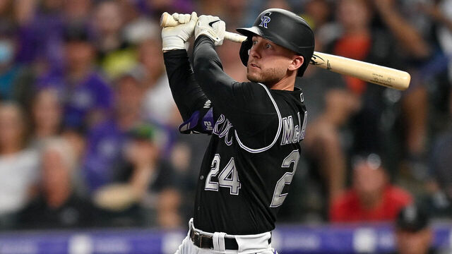 DENVER, CO - SEPTEMBER 25: Colorado Rockies second baseman Ryan McMahon (24) hits a first inning RBI double during a game between the Colorado Rockies and the San Francisco Giants at Coors Field in Denver, Colorado on September 25, 2021.