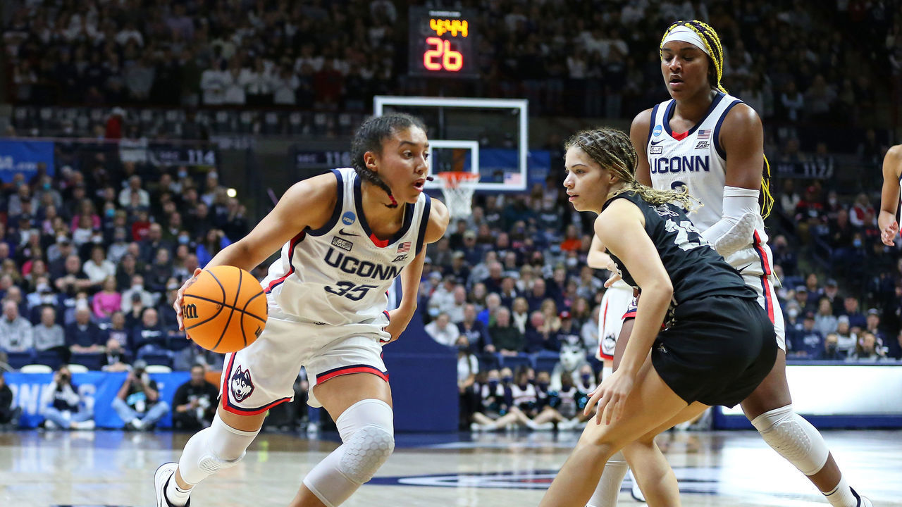STORRS, CT - MARCH 21: UConn Huskies guard Azzi Fudd (35) drives past UCF Knights guard Alisha Lewis (23) during the second round of the Women's Div I NCAA Basketball Championship between UCF Knights and UConn Huskies on March 21, 2022, at Harry A. Gampel Pavilion in Storrs, CT.