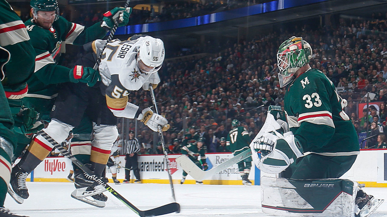 SAINT PAUL, MN - MARCH 21: Dmitry Kulikov #7 and Cam Talbot #33 of the Minnesota Wild defend their goal against Keegan Kolesar #55 of the Vegas Golden Knights during the game at the Xcel Energy Center on March 21, 2022 in Saint Paul, Minnesota.
