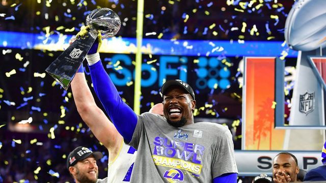 Los Angeles Rams' Von Miller holds up the trophy after winning Super Bowl LVI against the Cincinnati Bengals at SoFi Stadium in Inglewood, California, on February 13, 2022.