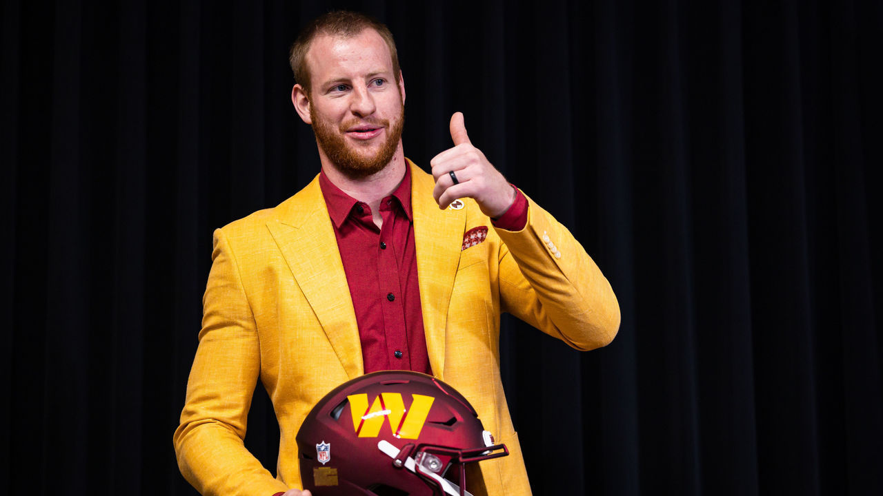 ASHBURN, VA - MARCH 17: Quarterback Carson Wentz of the Washington Commanders stands with a helmet after being introduced at Inova Sports Performance Center on March 17, 2022 in Ashburn, Virginia.