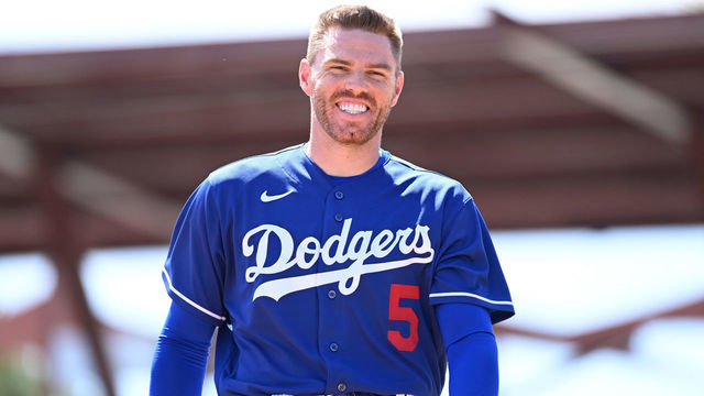 GLENDALE, ARIZONA - MARCH 22: Freddie Freeman #5 of the Los Angeles Dodgers walks to the dugout against the Cincinnati Reds during a spring training game at Camelback Ranch on March 22, 2022 in Glendale, Arizona.