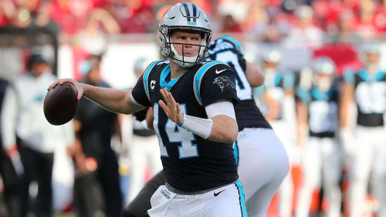TAMPA, FL - JANUARY 9: Carolina Panthers Quarterback Sam Darnold (14) looks for an open receiver during the regular season game between the Carolina Panthers and the Tampa Bay Buccaneers on January 9, 2022 at Raymond James Stadium in Tampa, Florida.