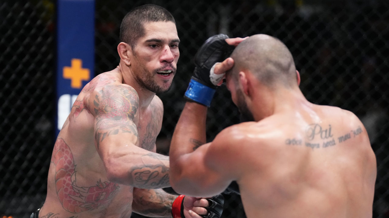 LAS VEGAS, NEVADA - MARCH 12: (L-R) Alex Pereira of Brazil punches Bruno Silva of Brazil in their middleweight fight during the UFC Fight Night event at UFC APEX on March 12, 2022 in Las Vegas, Nevada.