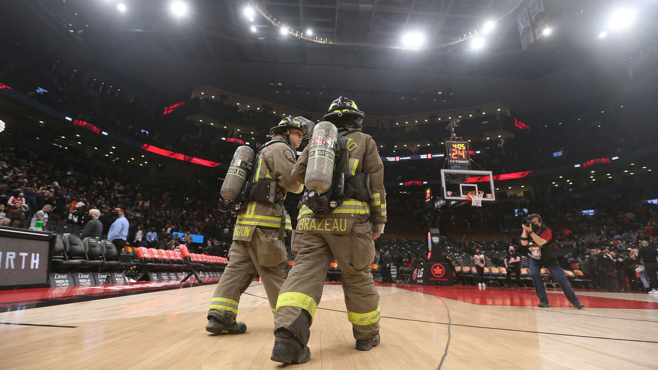 TORONTO, ON- MARCH 26 - Toronto Fire begins to evacuate the arena. A fire on a speaker in the rafters of Scotiabank Arena forces the arena to be evacuated as the Toronto Raptors play the Indiana Pacers at Scotiabank Arena in Toronto. March 26, 2022. (Steve Russell/Toronto Star via Getty Images)